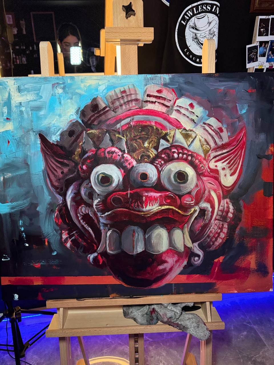 Mask painting on easel in studio