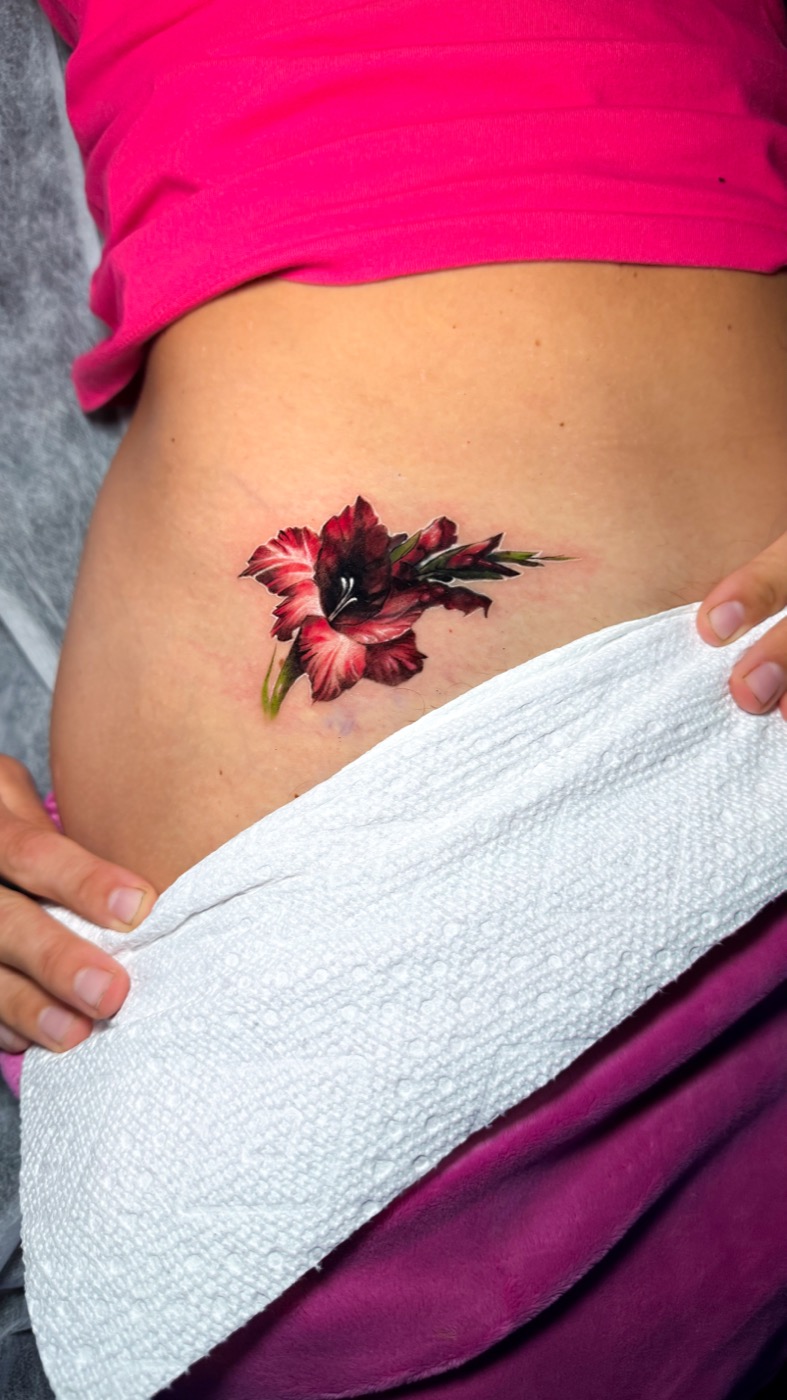 Crimson Gladiolus — Floral Realism tattoo by Laurent Alba, Denver